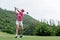 Golfer sport course golf ball fairway.Â   Group People lifestyle man and friend playing game golf tee of on the green grass